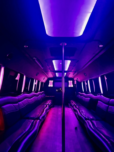 Luxury party bus interior with ambient lighting